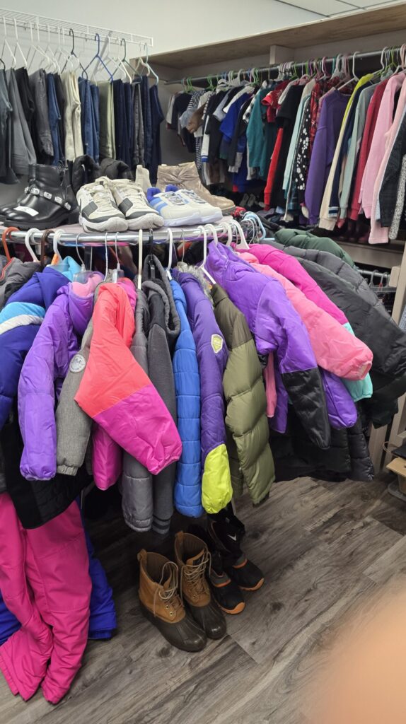 Clothing rack with coats.